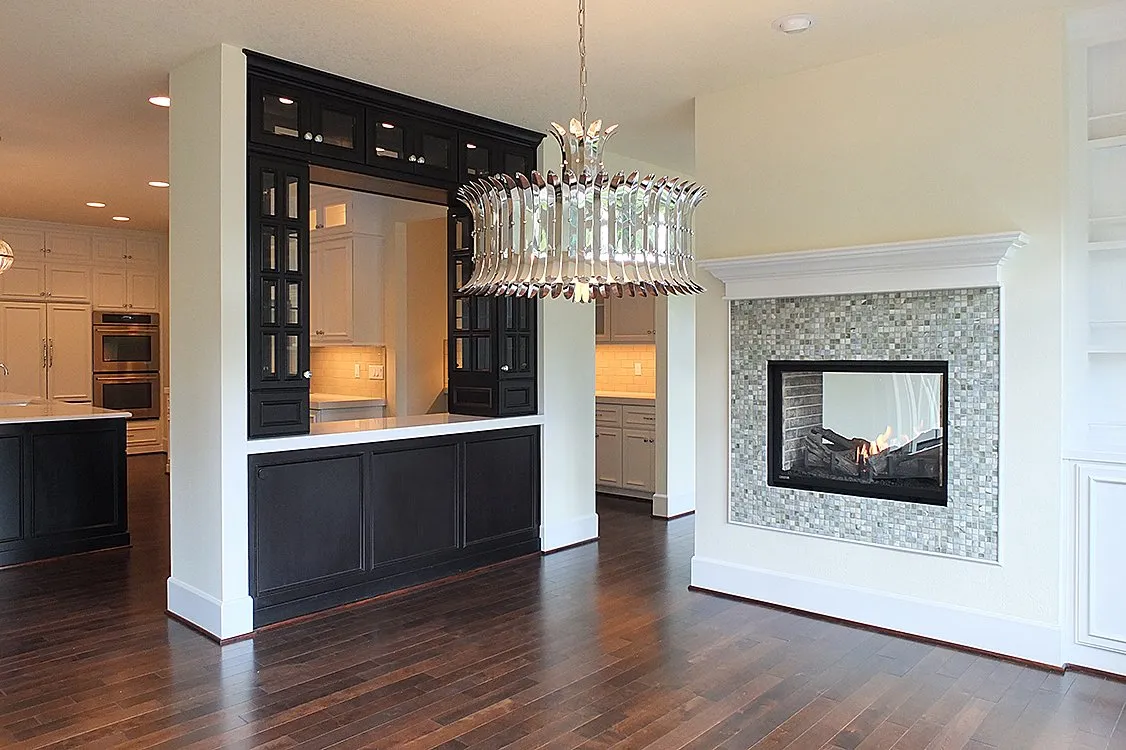 black cabinet paint with chandelier and white trims